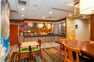a dining room with a table and chairs at Fairfield Inn & Suites Temecula in Temecula