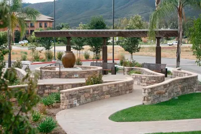 a park with benches and a pavilion with a vase at SpringHill Suites Temecula Valley Wine Country in Temecula