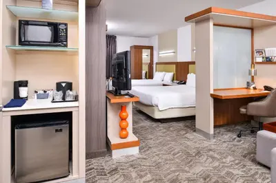 a hotel room with a bed and a television at SpringHill Suites Temecula Valley Wine Country in Temecula