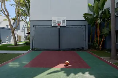 a basketball hoop with a ball on a court at Residence Inn San Diego Carlsbad in Carlsbad