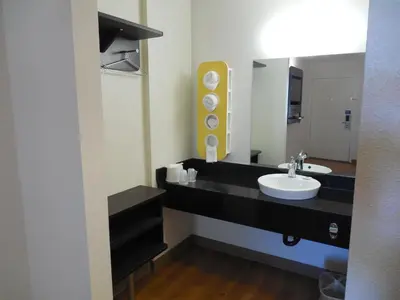 a bathroom with a sink and a mirror at Motel 6-Temecula, CA - Historic Old Town in Temecula