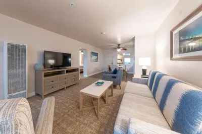 a living room with a couch and a tv at Southern California Beach Club in Oceanside