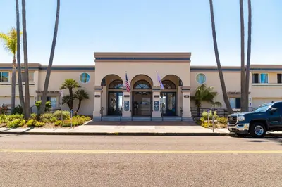 a truck parked in front of a building at Southern California Beach Club in Oceanside
