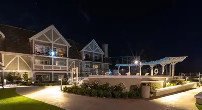 a large house at night with lights at Carlsbad Inn Beach Resort in Carlsbad
