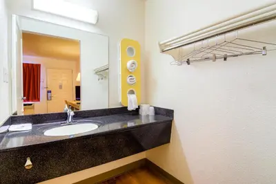 a bathroom with a sink and a large mirror at Motel 6-El Cajon, CA - San Diego in El Cajon