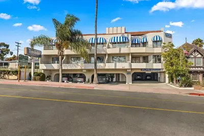 an empty street in front of a building at Travelodge by Wyndham San Clemente Beach in San Clemente
