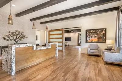 a lobby with a staircase and a living room at Riviera Oaks Resort in Ramona