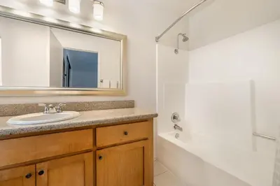 a bathroom with a sink and a shower at Riviera Oaks Resort in Ramona