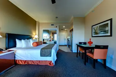 a hotel room with a bed and a desk at Club Wyndham Harbour Lights in San Diego