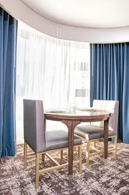 a dining room with a wooden table and chairs at Club Wyndham Harbour Lights in San Diego