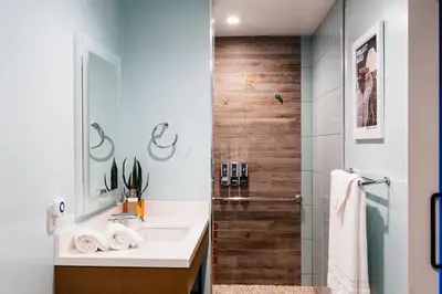 a bathroom with a sink and a shower at Surfhouse in Encinitas