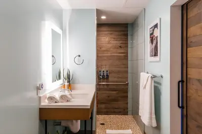 a bathroom with a sink and a shower at Surfhouse in Encinitas