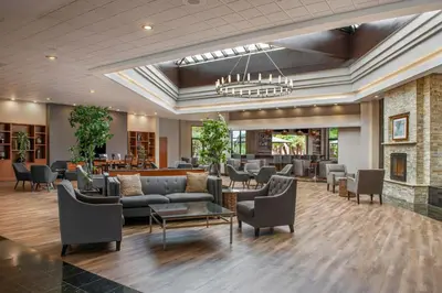 a lobby with couches and chairs and a waiting room at Four Points by Sheraton San Diego in San Diego