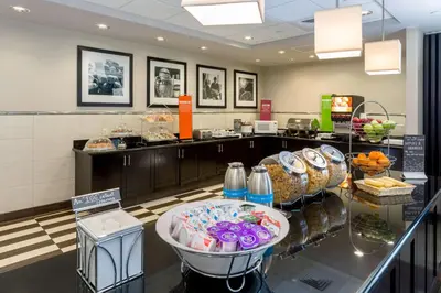 a bakery with a counter with food on it at Hampton Inn & Suites San Diego-Poway in Poway