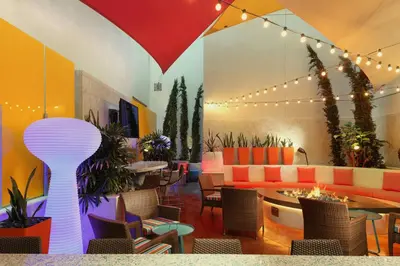 a restaurant with colorful furniture and tables and chairs at TownePlace Suites by Marriott San Diego Downtown in San Diego