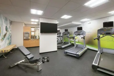 a gym with treadmills and ellipticals in a room at TownePlace Suites by Marriott San Diego Downtown in San Diego