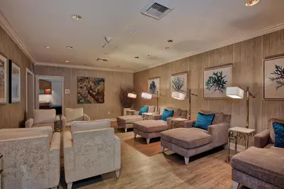 a waiting room with chairs and couches and tables at Balboa Bay Resort in Newport Beach