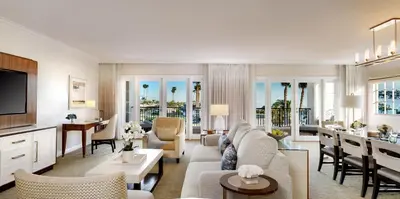 a living room with a couch and a table at Balboa Bay Resort in Newport Beach