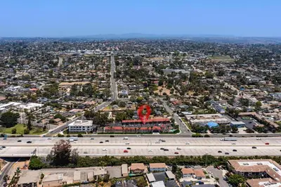 an aerial view of a city with a freeway at Hyland Inn near Legoland in Carlsbad