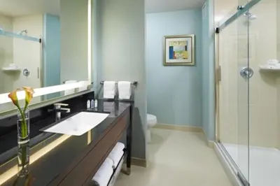 a bathroom with a sink and a shower at Hampton Inn San Diego Mission Valley in San Diego