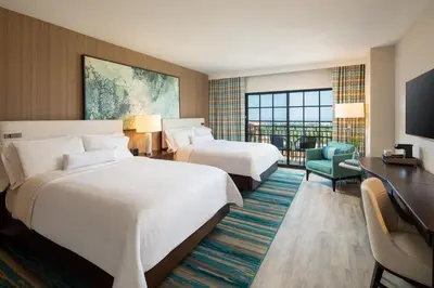 a hotel room with two beds and a television at The Westin Carlsbad Resort & Spa in Carlsbad