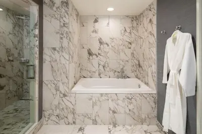 a bathroom with a bath tub and a sink at The Westin Carlsbad Resort & Spa in Carlsbad