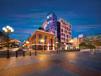 a city street with tall buildings at night at Hard Rock Hotel San Diego in San Diego