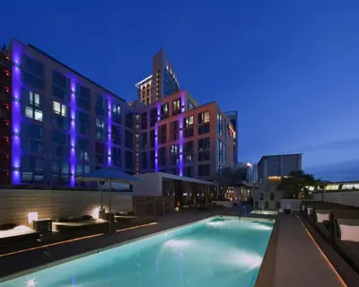 a swimming pool in front of a building at night at Hard Rock Hotel San Diego in San Diego