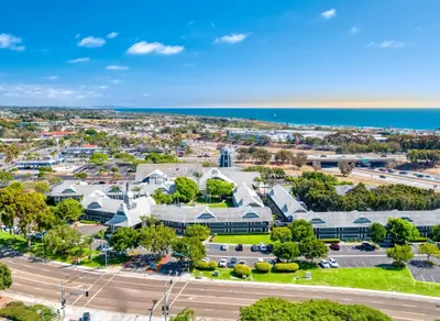 an aerial view of a city with a road and buildings at Carlsbad by the Sea Hotel in Carlsbad