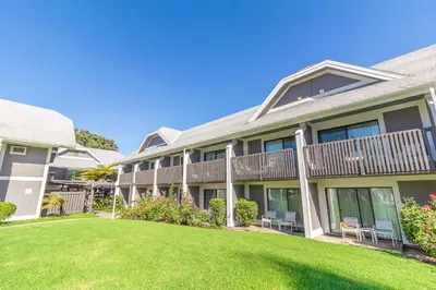 a house with a lawn in front of it at Carlsbad by the Sea Hotel in Carlsbad