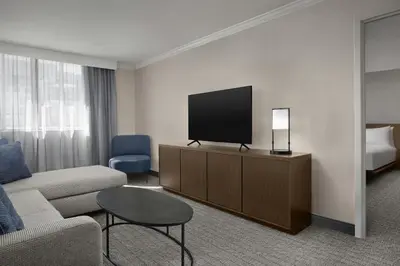 a living room with a couch and a television at Courtyard by Marriott San Diego Downtown Little Italy in San Diego
