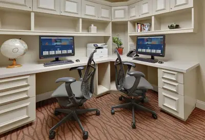 an office with two computer monitors and two chairs at Hilton Garden Inn San Diego Del Mar in San Diego