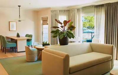 a living room with a couch and a table at Hilton San Diego/Del Mar in San Diego