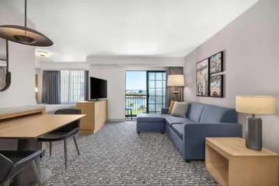 a living room with a couch and a table at Homewood Suites by Hilton San Diego Airport-Liberty Station in San Diego