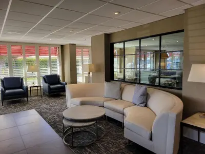 a lobby with a couch and a table and chairs at Hampton Inn by Hilton San Diego - Kearny Mesa in San Diego