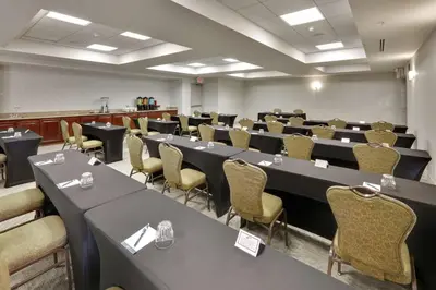 a conference room with long tables and chairs at Homewood Suites by Hilton San Diego-Del Mar in San Diego