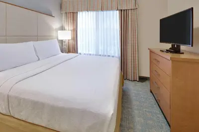 a hotel room with a bed and a television at Homewood Suites by Hilton San Diego-Del Mar in San Diego