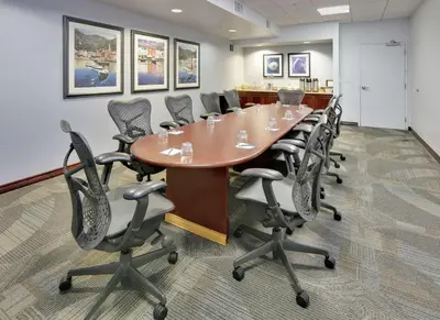 a conference room with a long table and chairs at Homewood Suites by Hilton San Diego-Del Mar in San Diego
