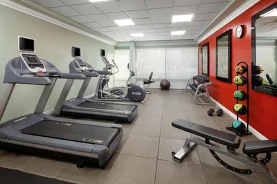 a gym with treadmills and elliptical machines at DoubleTree By Hilton San Diego Hotel Circle in San Diego