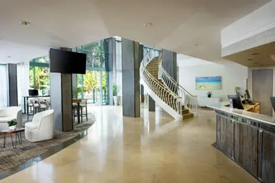 a living room with a staircase and a living room at DoubleTree By Hilton San Diego Hotel Circle in San Diego