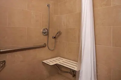 a shower with a shower curtain in a bathroom at DoubleTree by Hilton San Diego Del Mar in San Diego
