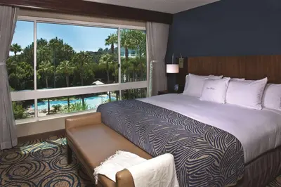 a bedroom with a large bed and a large window at DoubleTree by Hilton San Diego Del Mar in San Diego