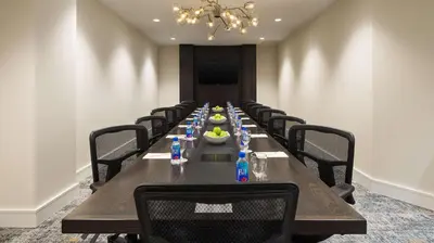 a long conference room with a long table with chairs at DoubleTree by Hilton San Diego Del Mar in San Diego
