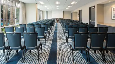 a room with rows of chairs in a classroom at DoubleTree by Hilton San Diego Del Mar in San Diego