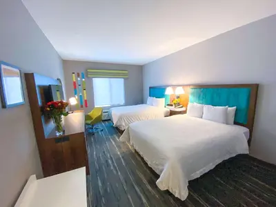 a large hotel room with two beds and a window at Hampton Inn Carlsbad North San Diego County in Carlsbad