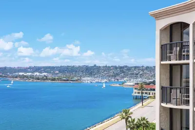a view of a large body of water between two buildings at Hilton San Diego Airport/Harbor Island in San Diego
