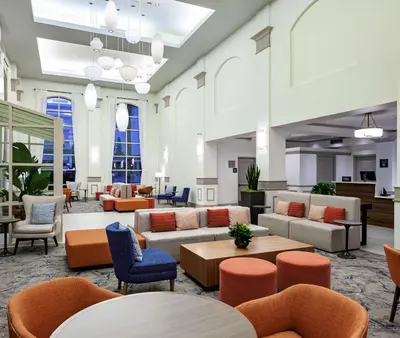 a lobby with couches and tables and chairs at Hilton Garden Inn San Diego/Rancho Bernardo in Rancho Bernardo