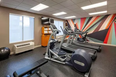 a gym with several tread machines in a room at Hilton Garden Inn San Diego/Rancho Bernardo in Rancho Bernardo