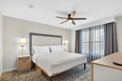 a bedroom with a bed and a ceiling fan at Homewood Suites by Hilton Carlsbad-North San Diego County in Carlsbad