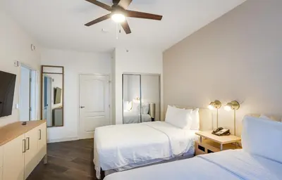 a bedroom with two beds and a ceiling fan at Homewood Suites by Hilton Carlsbad-North San Diego County in Carlsbad